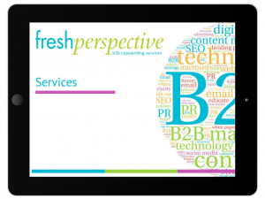 An iPad with a slide that says Fresh Perspective Copywriting Services and a wordcloud of B2b terms